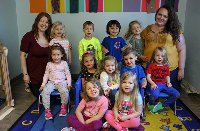 Senior Preschool class in the classroom with two teachers, three rows of kids